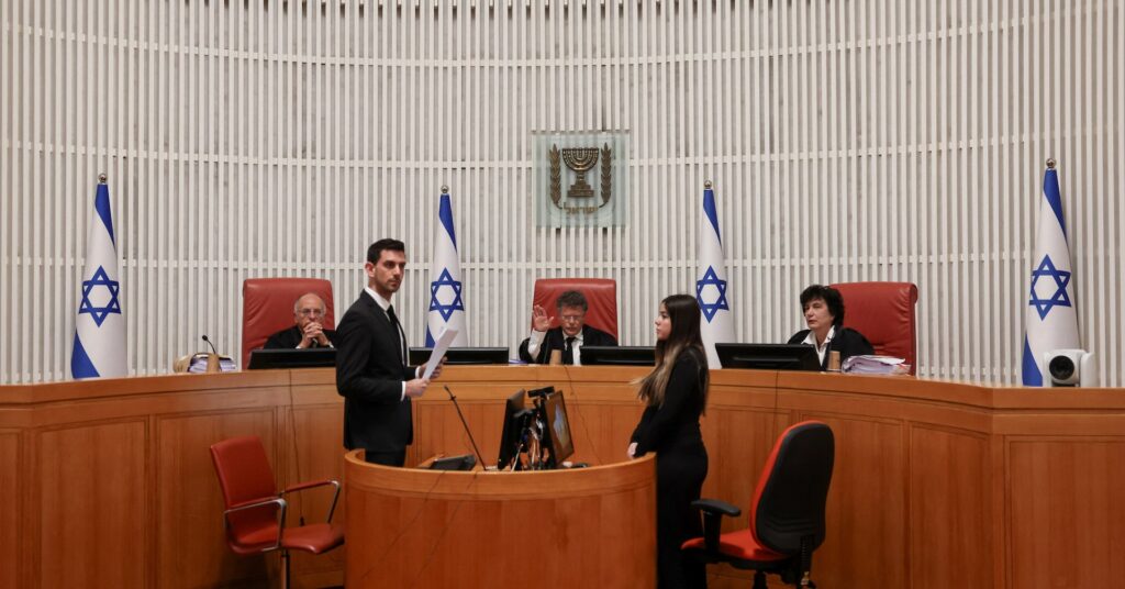 Ruckus in Israeli court as hearings begin on Netanyahu bid to sack spy chief